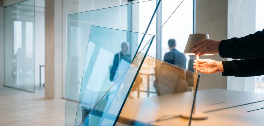 Two panes of glass overlapping in front of a window
